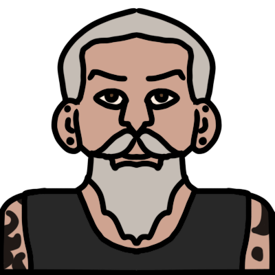 a head and shoulders portrait of a person with light skin, silver straight long beard and short hair, and two black stud earrings in each ear, one in the earlobe and one higher. They are wearing a dark grey singlet and have abstract black tattoos on their arms and shoulders.